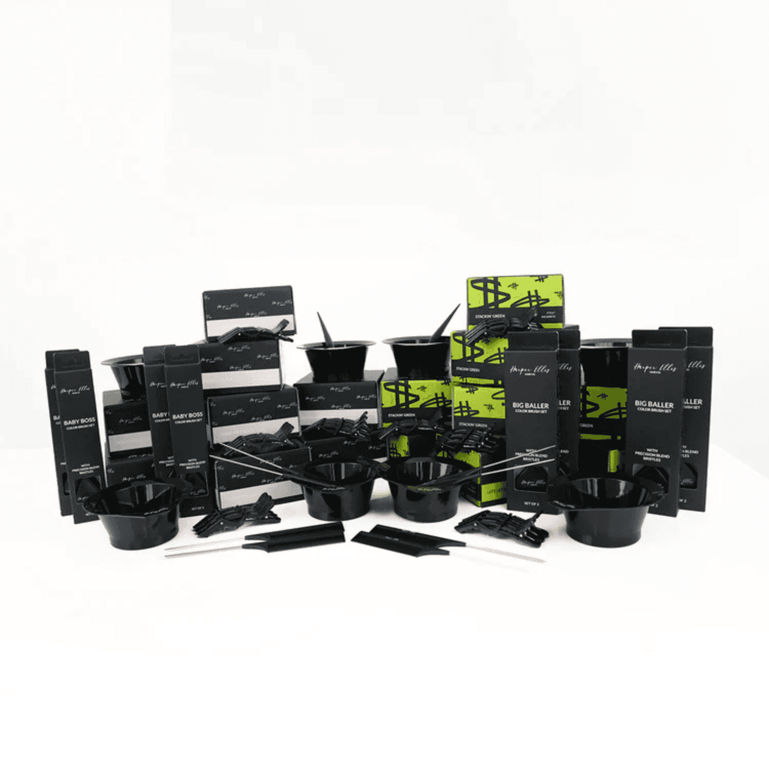 Hair dye kit with bowls, brushes, gloves, and various dye packages arranged on display.